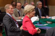 Committe Member Sen. Elizabeth Warren and Chairman Nelson listen intently.